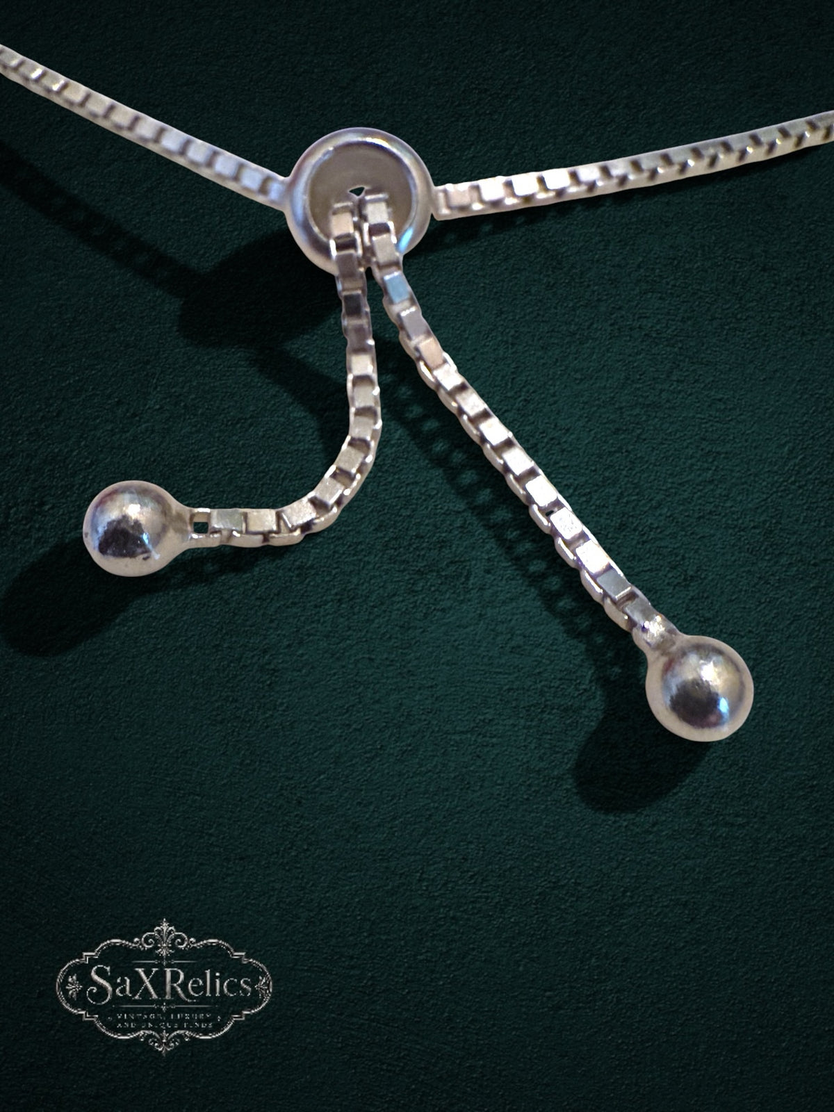 My Store adjustable bolo-style sliding clasp on a silver-tone box chain bracelet with spherical end beads