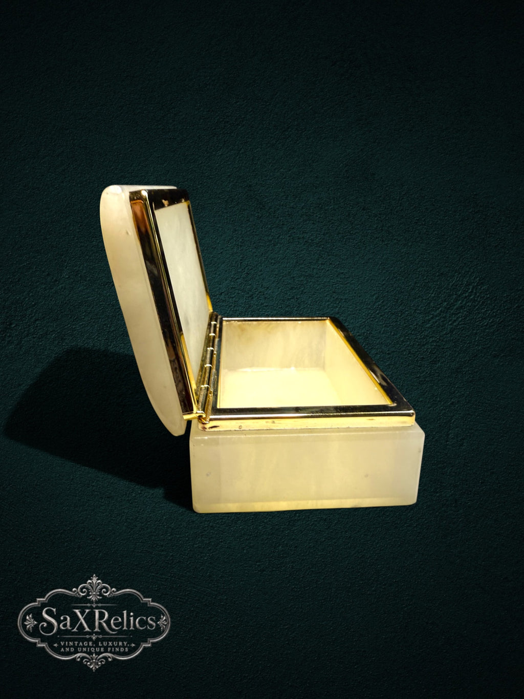 Vintage-inspired alabaster trinket box with a polished gold-tone metal trim and open lid