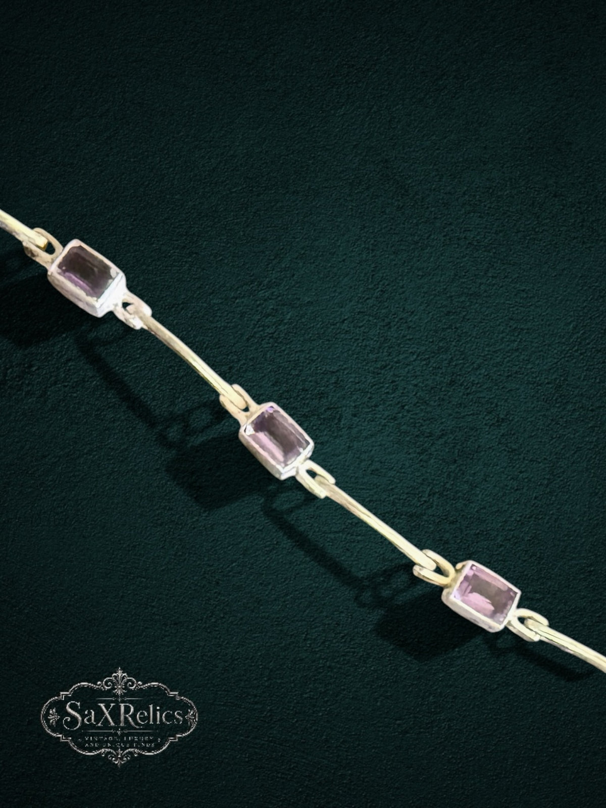My Store SAXRelics elegant link bracelet featuring rectangular-cut amethyst stones in a polished metal setting.