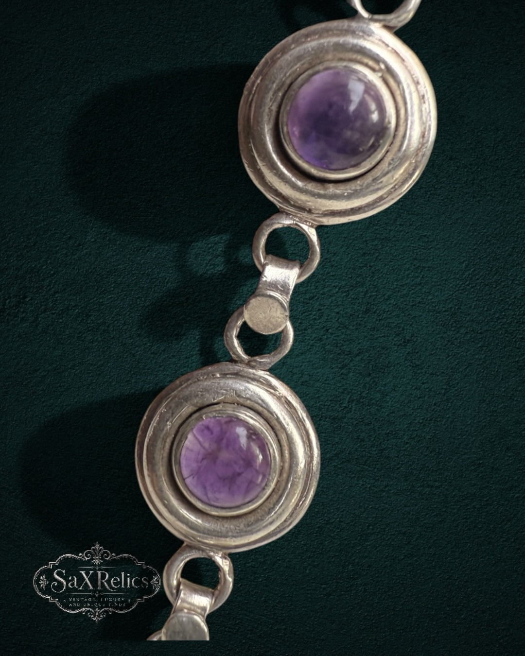 My Store vintage sterling silver bracelet featuring deep purple amethyst cabochons in circular bezel settings.