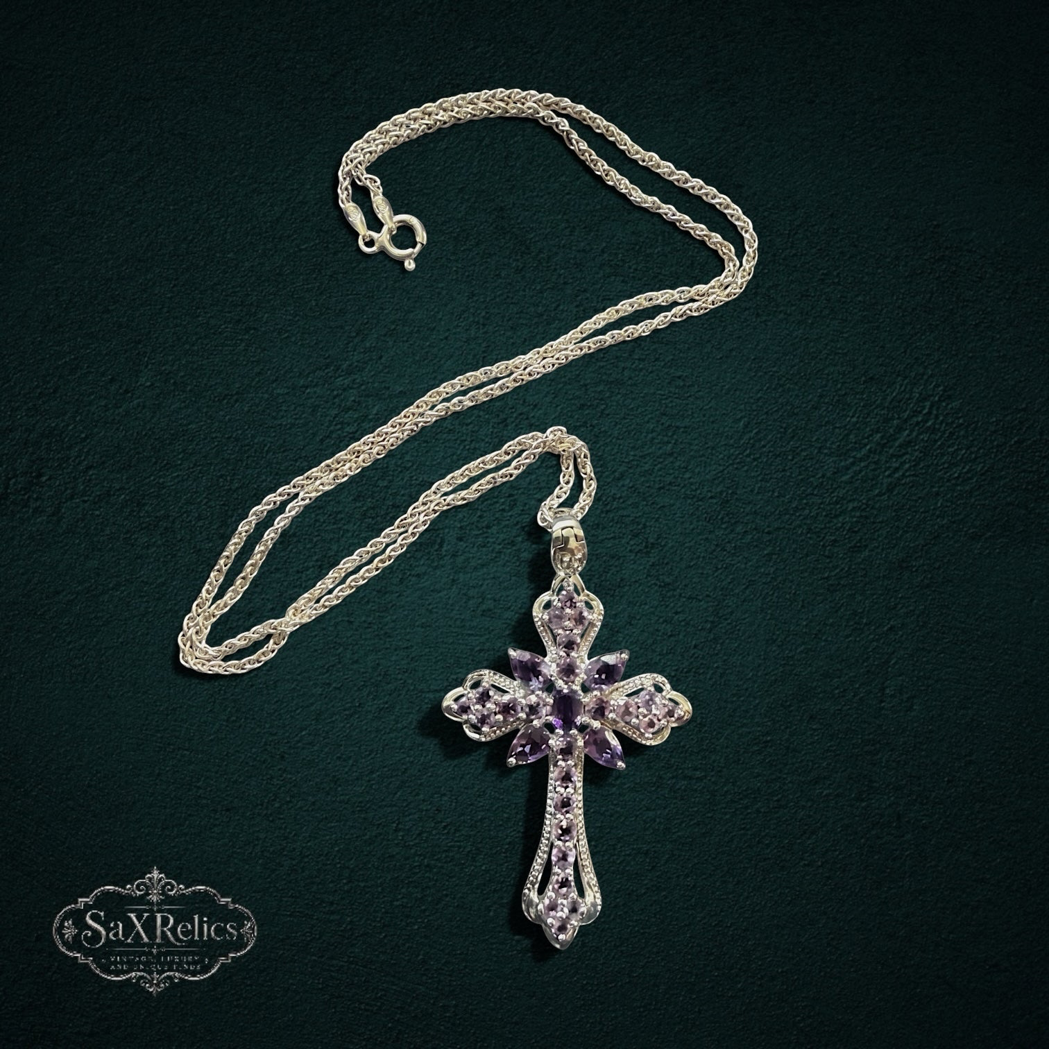 My Store sterling silver cross pendant necklace featuring ornate filigree detailing and deep purple amethyst gemstones.