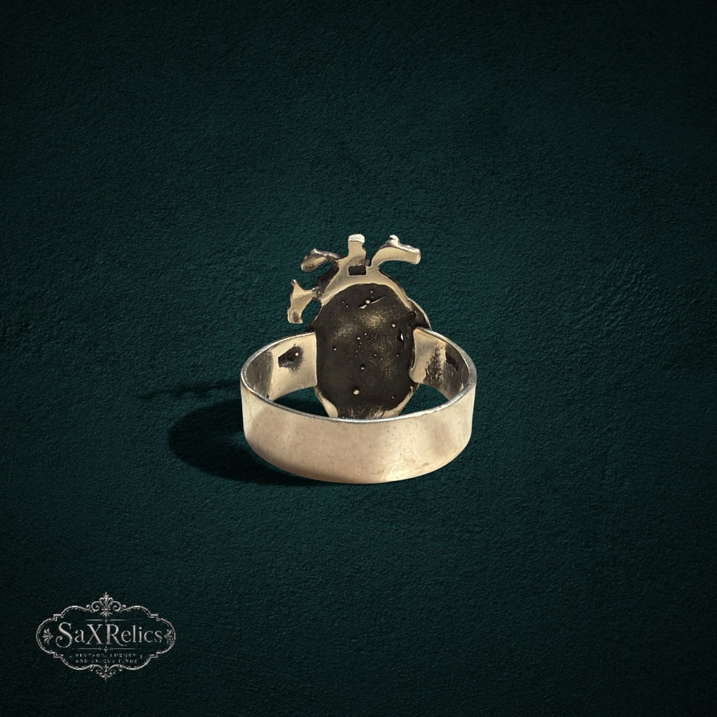 My Store SAXRelics silver-toned anatomical heart statement ring with detailed gothic design on dark background