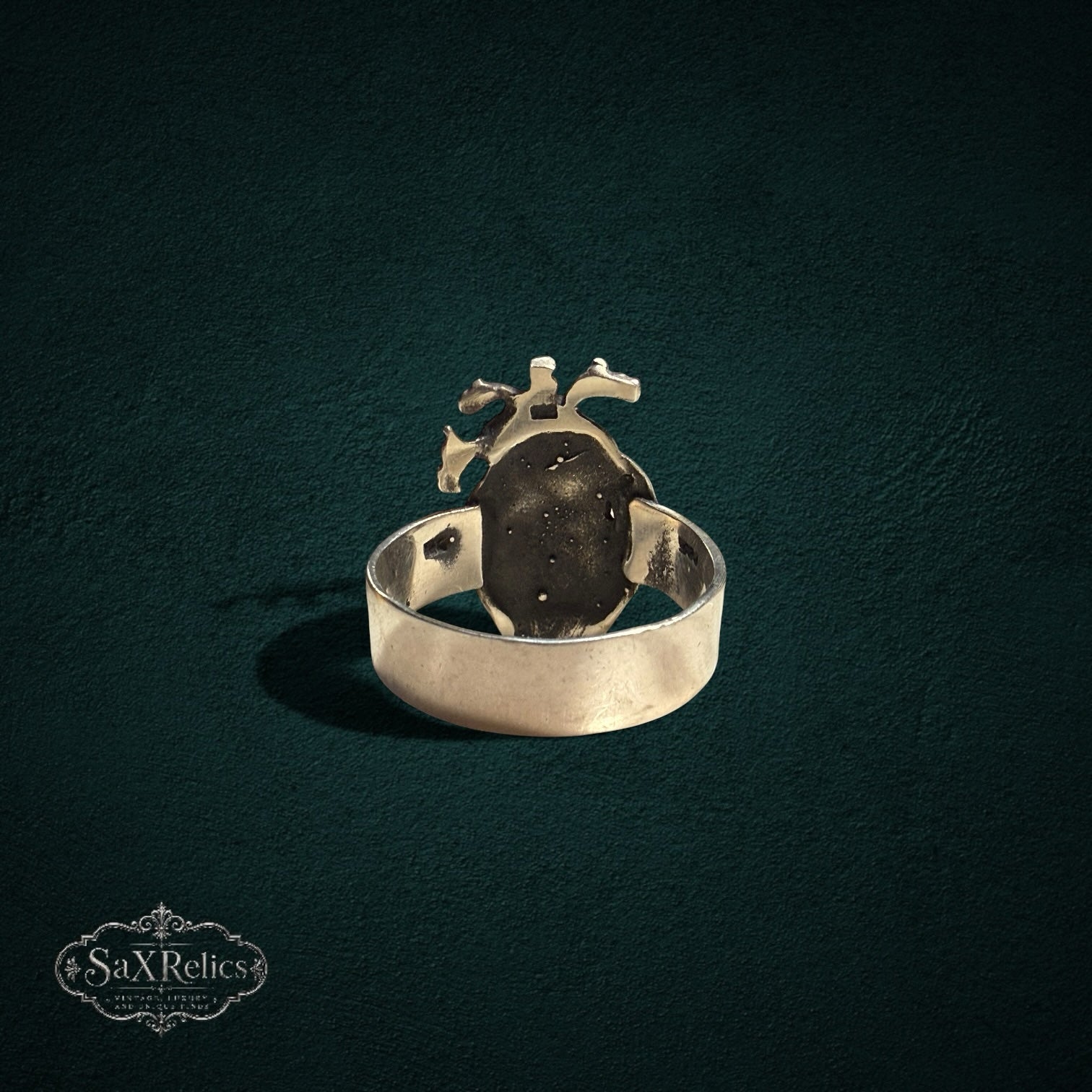 My Store SAXRelics silver-toned anatomical heart statement ring with detailed gothic design on dark background