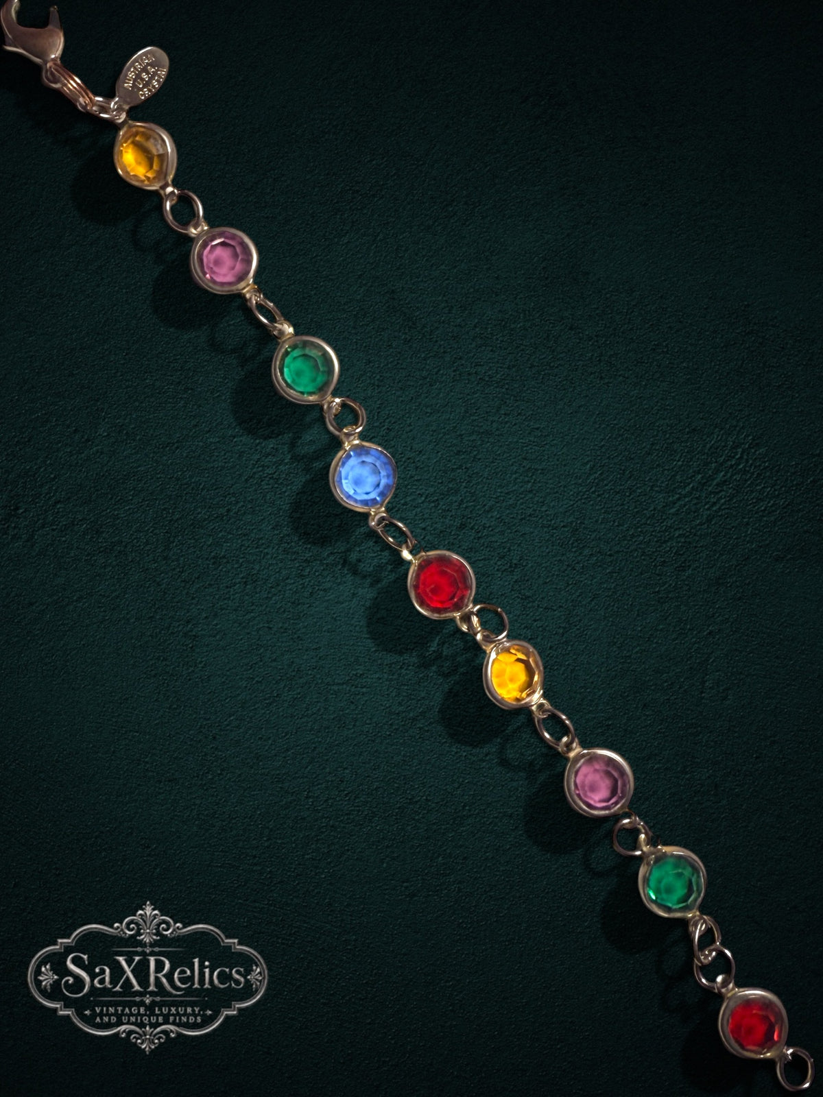 My Store vintage Austrian crystal link bracelet featuring multi-colored faceted stones in a polished gold-tone setting.