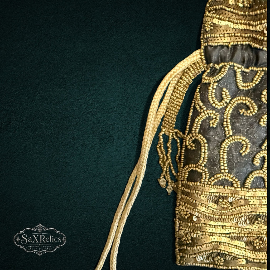 My Store SAXRelics black drawstring pouch with intricate gold sequin embroidery and braided cords for formal events.