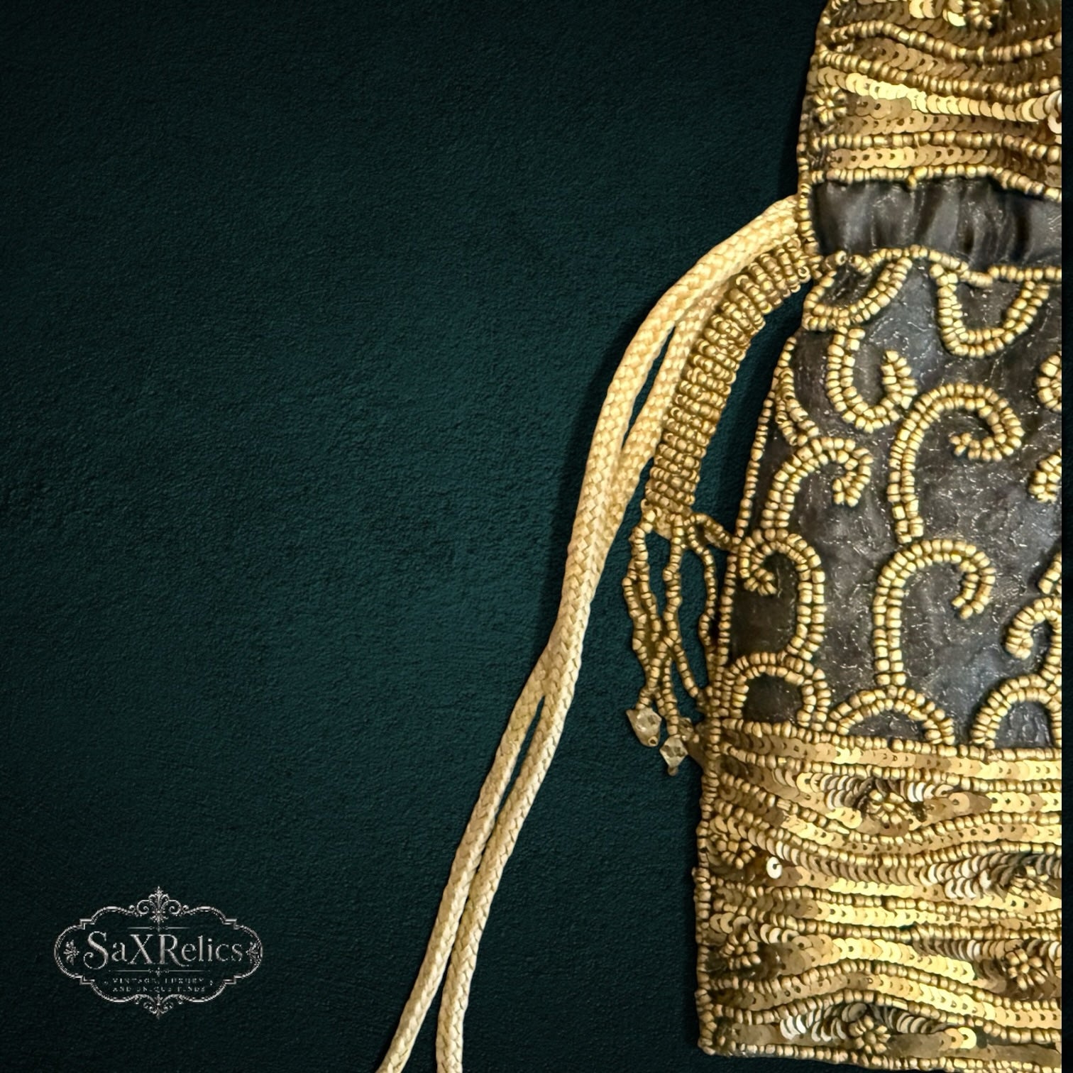 My Store SAXRelics black drawstring pouch with intricate gold sequin embroidery and braided cords for formal events.