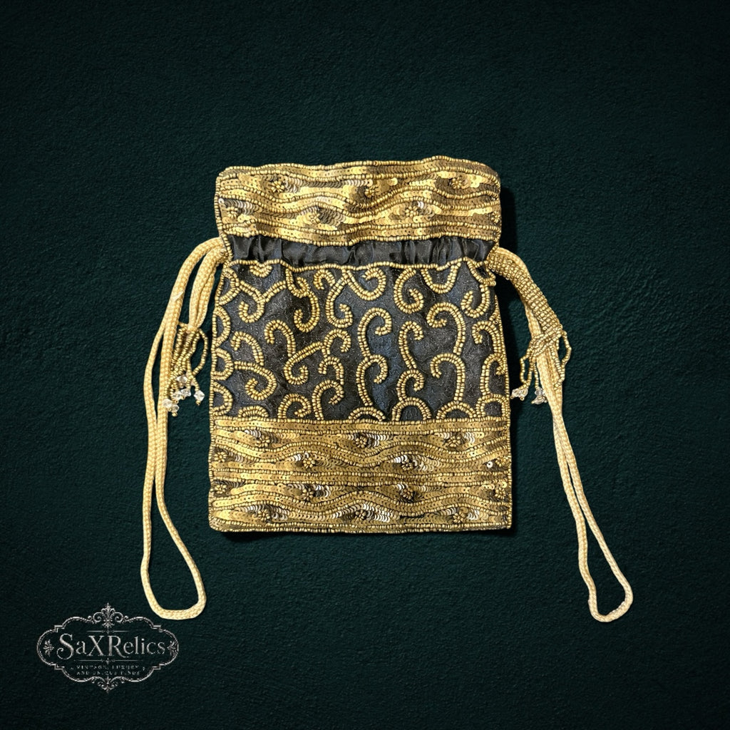 My Store SAXRelics black drawstring pouch featuring intricate gold beadwork and sequin embroidery for evening wear.
