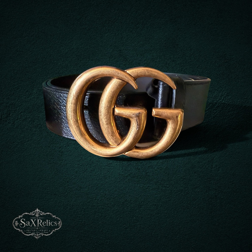 My Store black leather belt featuring an iconic interlocking GG buckle in a brushed antique gold finish.