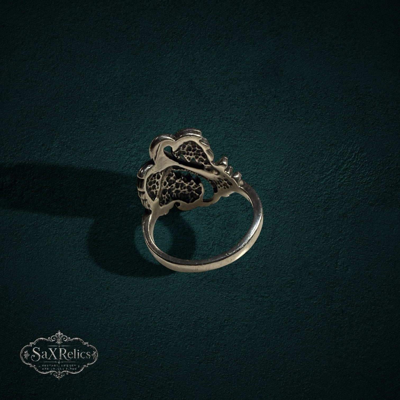 My Store SAXRelics sterling silver ring featuring an intricate botanical leaf and berry design with oxidized finish.