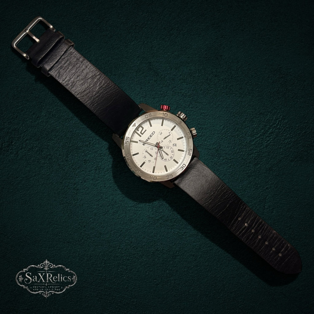 SaX Relics Breed chronograph watch with a white dial, red pusher accent, and black genuine leather strap
