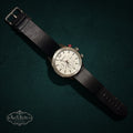 SaX Relics Breed chronograph watch with a white dial, red pusher accent, and black genuine leather strap