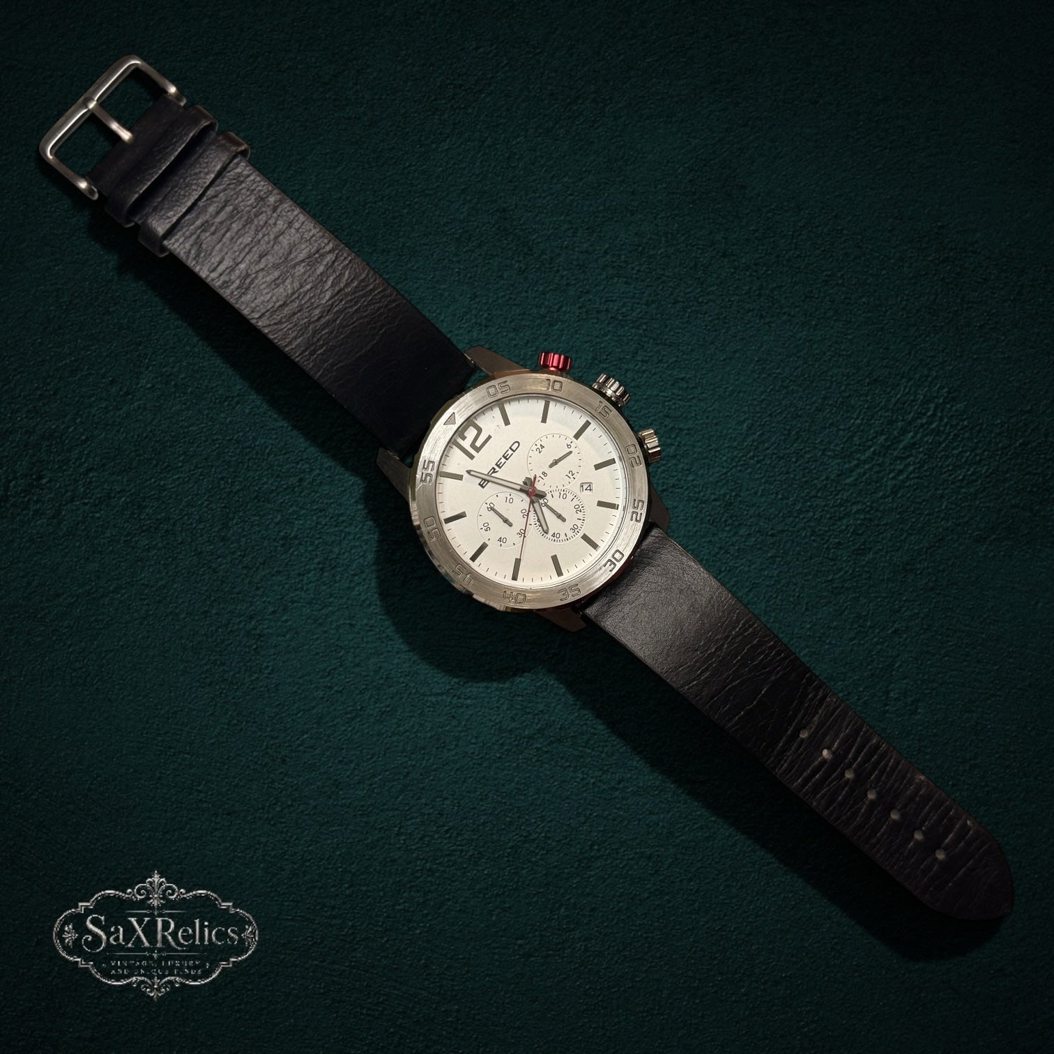 SaX Relics Breed chronograph watch with a white dial, red pusher accent, and black genuine leather strap