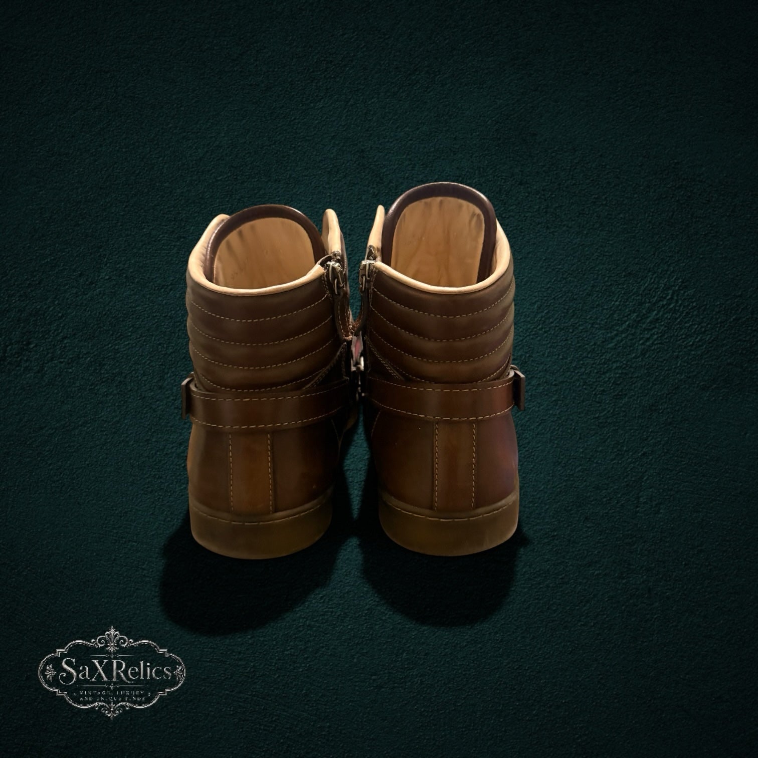 My Store brown leather high-top sneakers with padded collars and side-zip closures viewed from the back.