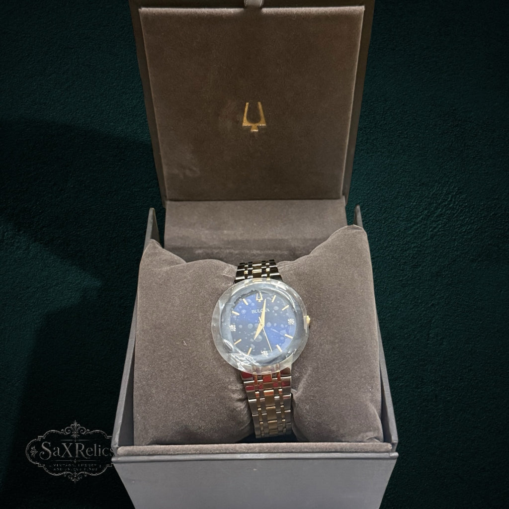 My Store Bulova two-tone stainless steel watch with a blue dial and diamond accents in a presentation box