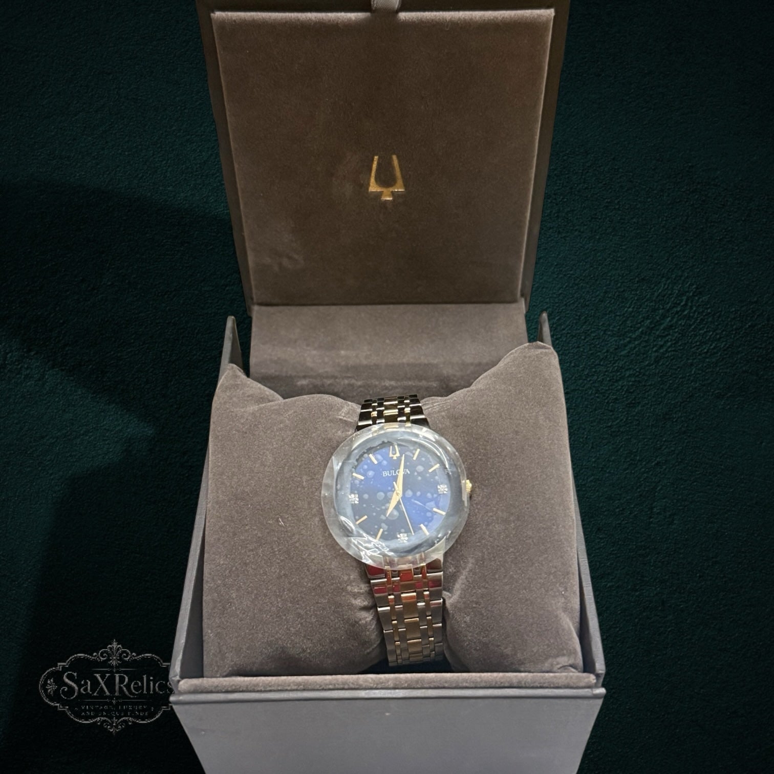 My Store Bulova two-tone stainless steel watch with a blue dial and diamond accents in a presentation box