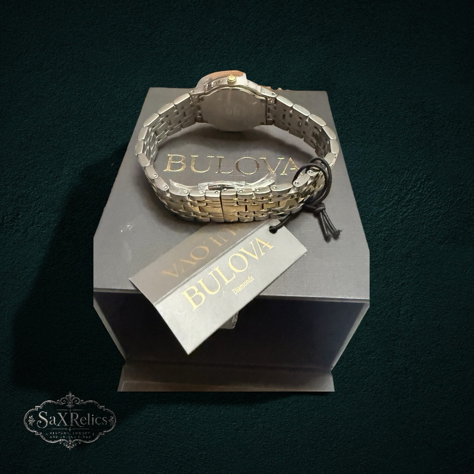My Store Bulova stainless steel two-tone watch with diamond accents resting on its branded presentation box.