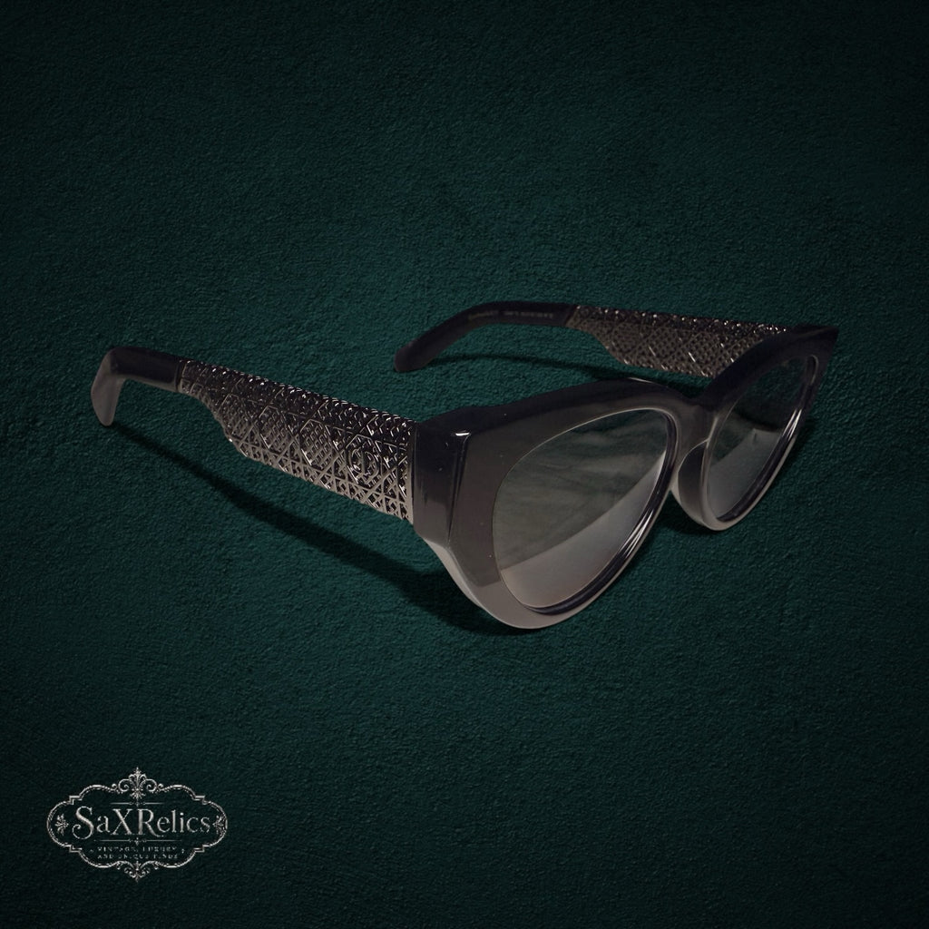 My Store Christian Dior Resille B1F black cat-eye sunglasses with intricate metallic latticework temple detailing.