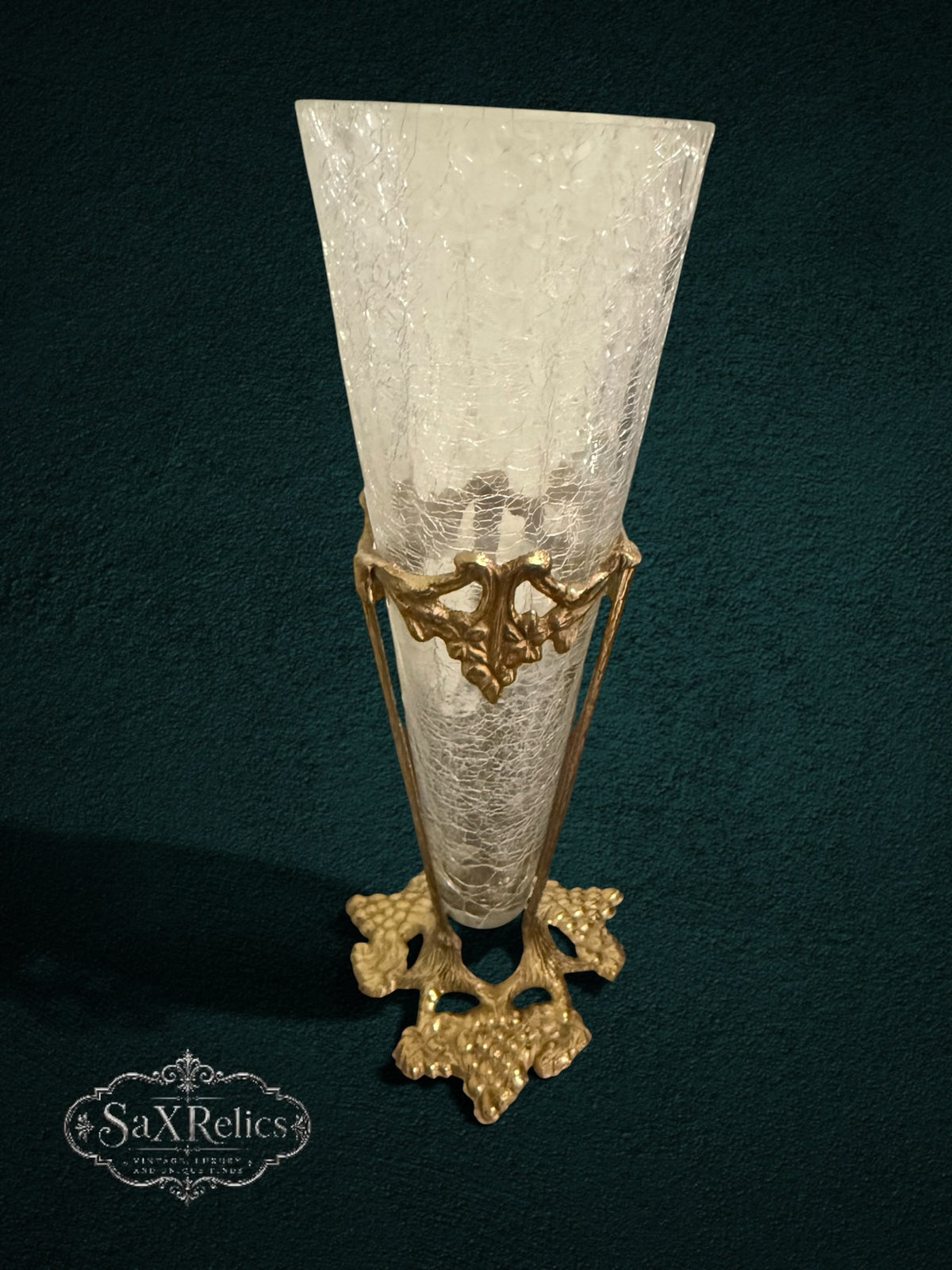 My Store vintage trumpet vase with crackle glass insert and ornate antique-gold metal stand featuring grape-vine motifs.
