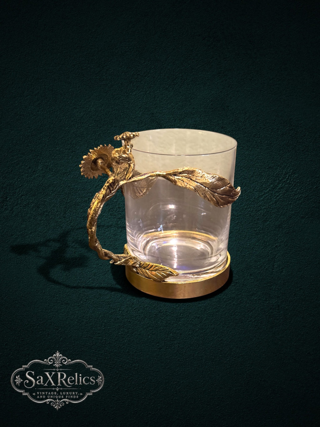 My Store decorative glass with an ornate antique-gold metal handle featuring sunflower and leaf motifs with crystals.