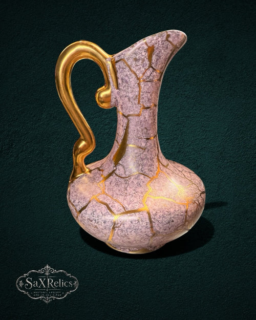 My Store SaxRelics dusty rose ceramic pitcher with gold crackle kintsugi detailing and a graceful curved handle