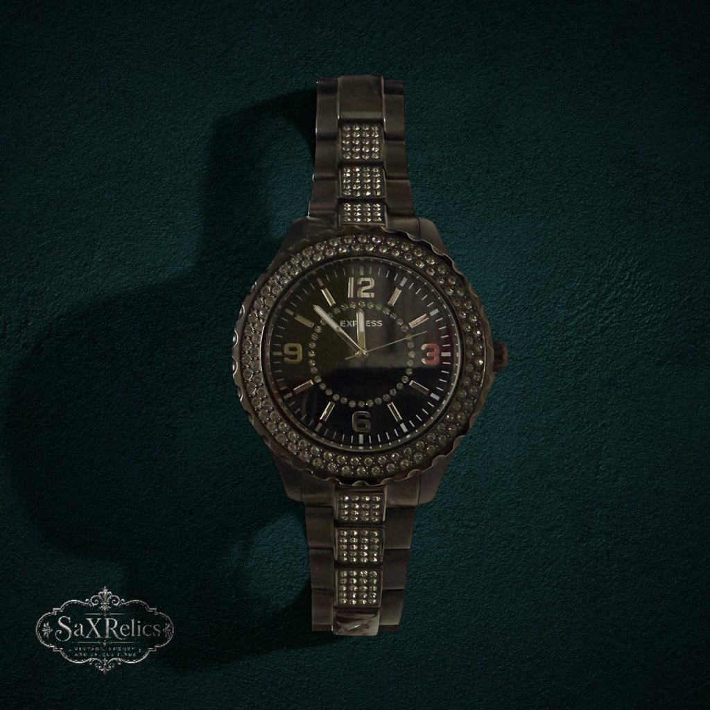 My Store EXPRESS dark metal link wristwatch with a crystal-encrusted bezel and matching bracelet accents