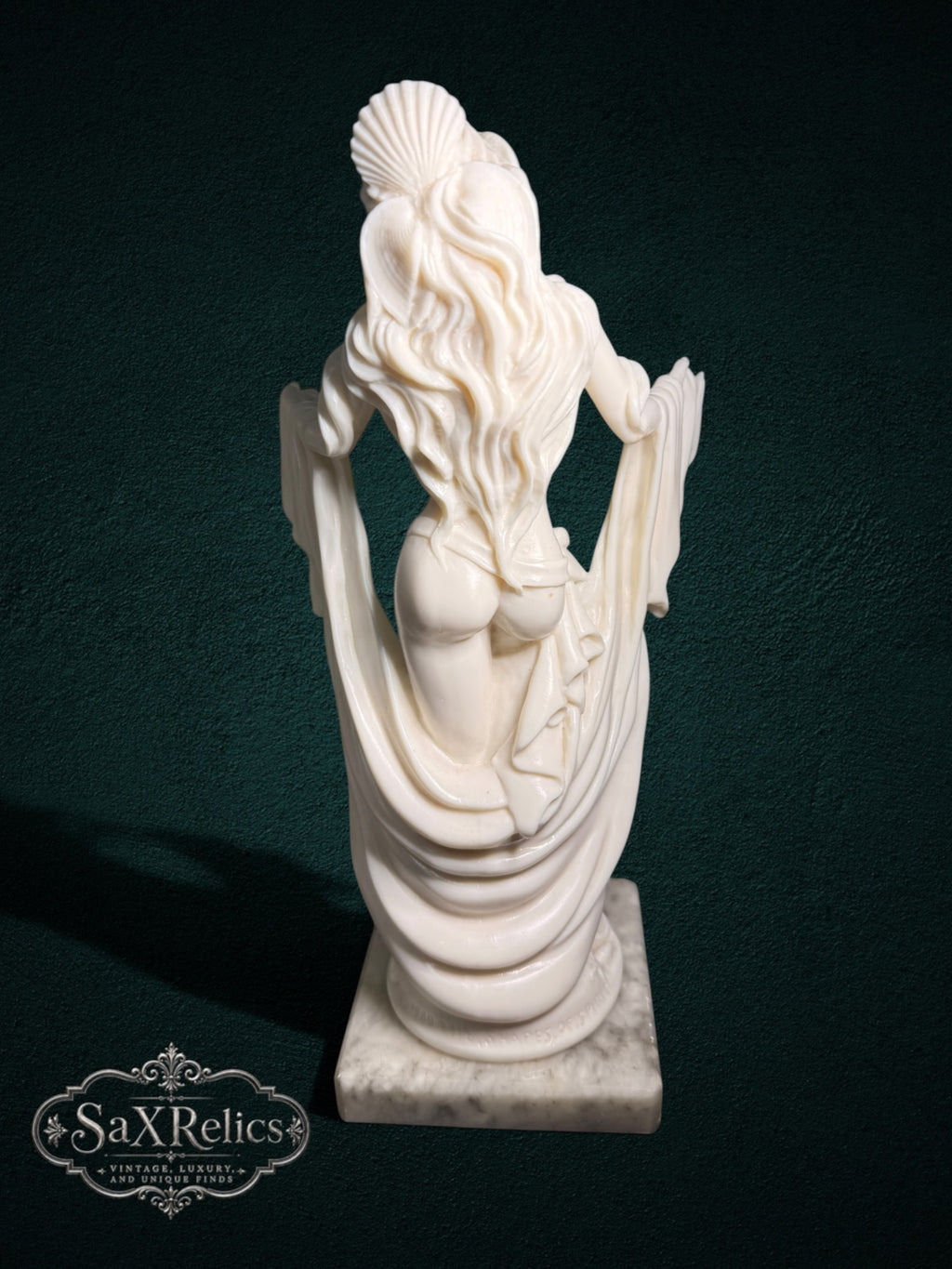 My Store ivory-toned female figurine sculpture with flowing draped fabric on a polished marble base, back view