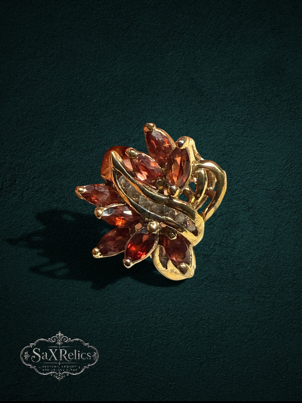 My Store vintage-inspired statement ring featuring marquise-cut red garnet stones and clear accents in gold-tone metal.
