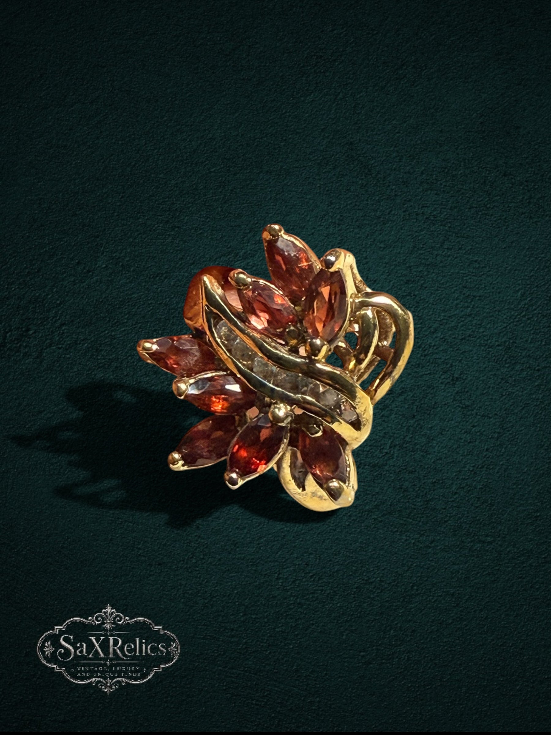 My Store vintage-inspired statement ring featuring marquise-cut red garnet stones and clear accents in gold-tone metal.