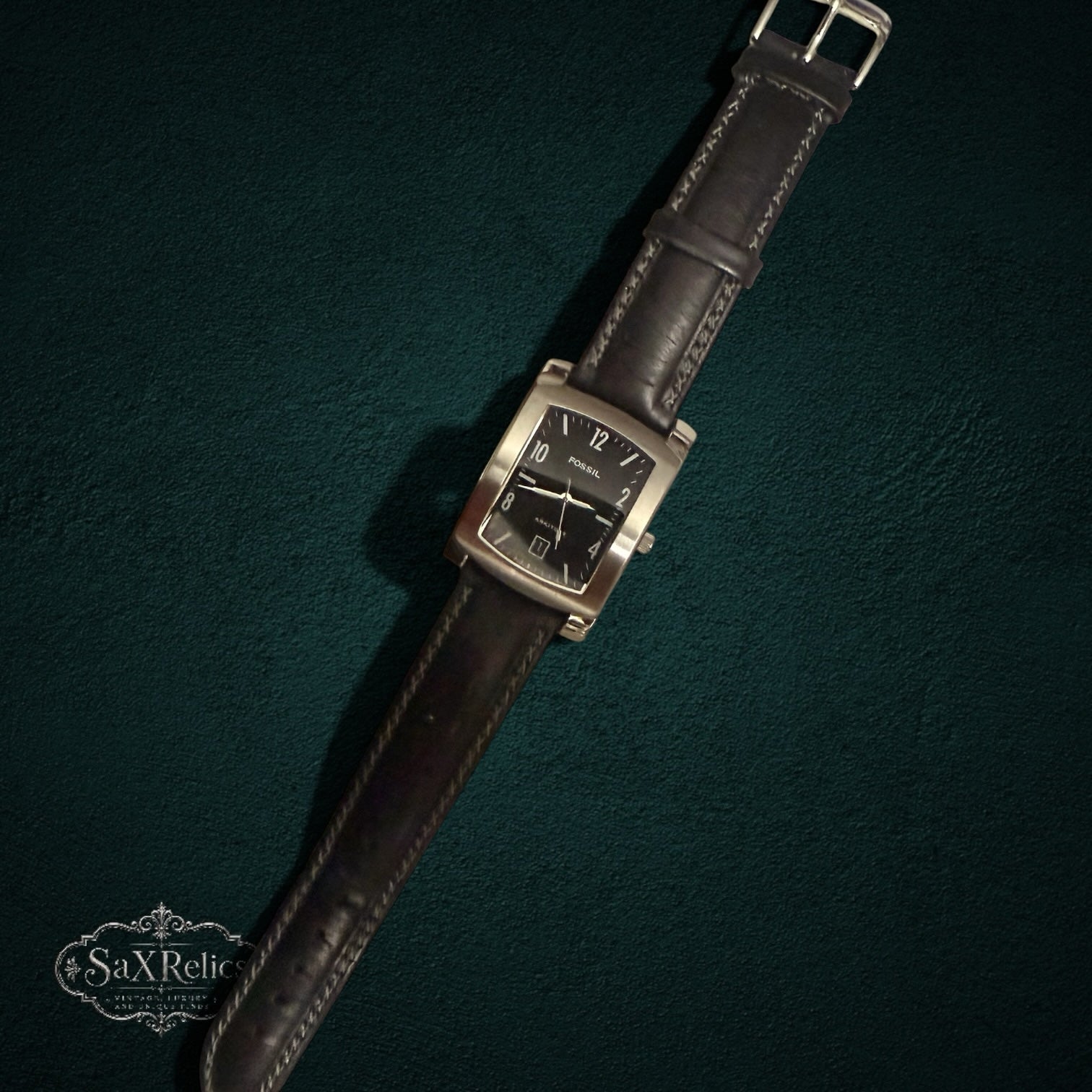 My Store Fossil Arkitekt rectangular men's watch with a black dial, stainless steel case, and dark leather strap.