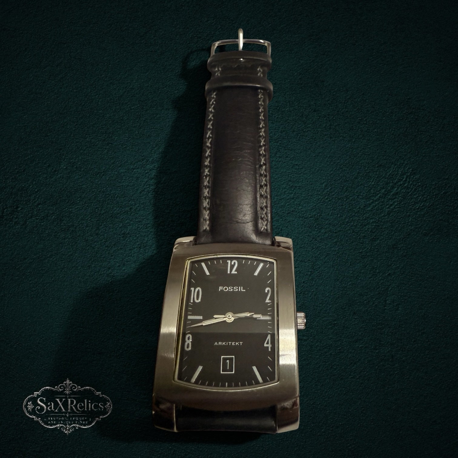 My Store Fossil Arkitekt rectangular men's watch with a black dial, stainless steel case, and dark leather strap.