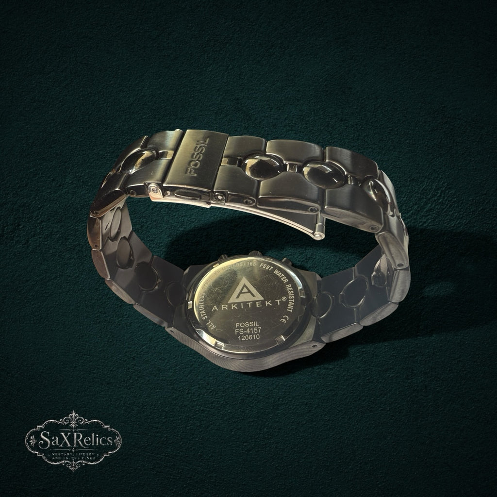 My Store Fossil Arkitekt stainless steel chronograph watch showing the engraved case back and articulated link bracelet
