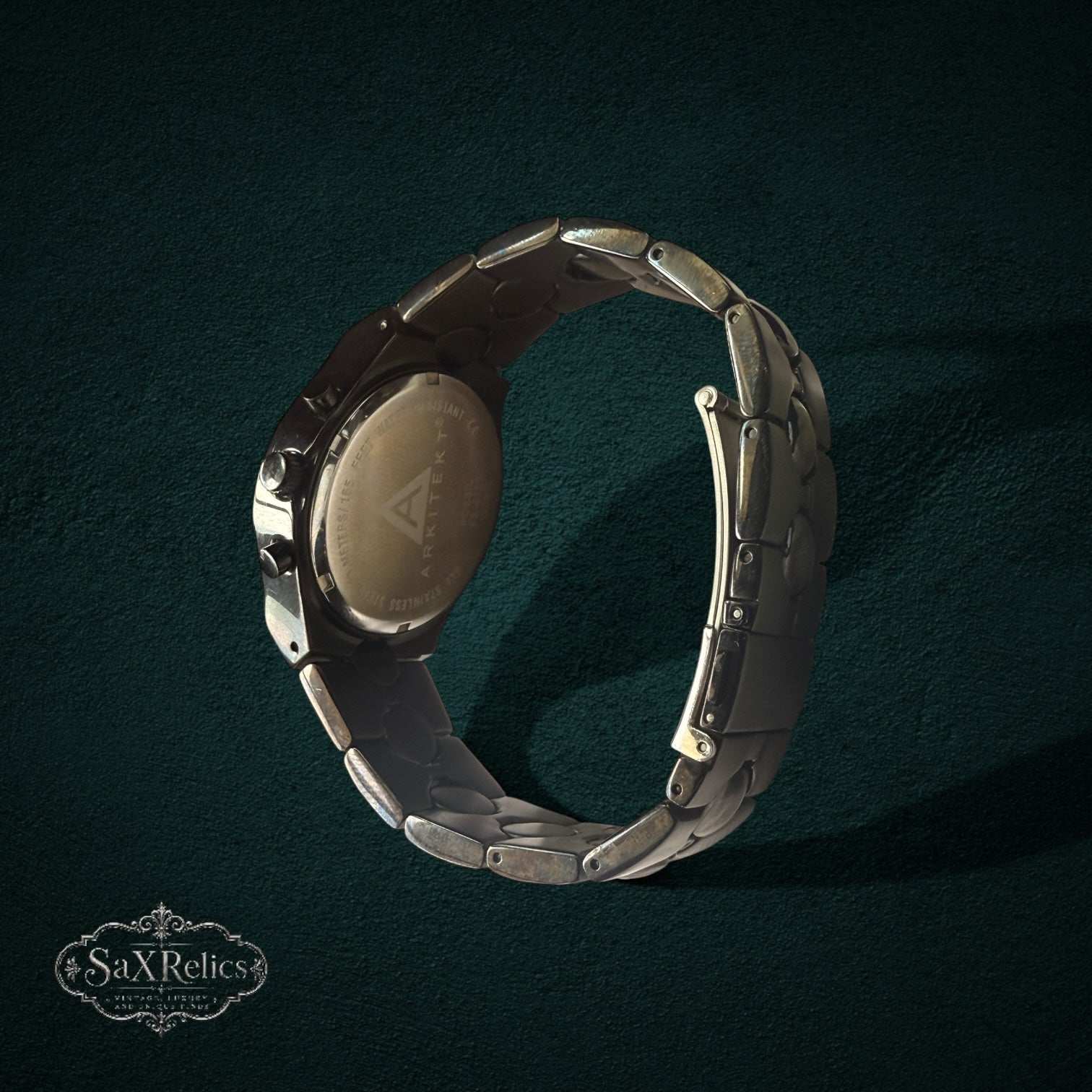My Store Fossil Arkitekt stainless steel chronograph watch showing the articulated link bracelet and case back detail.