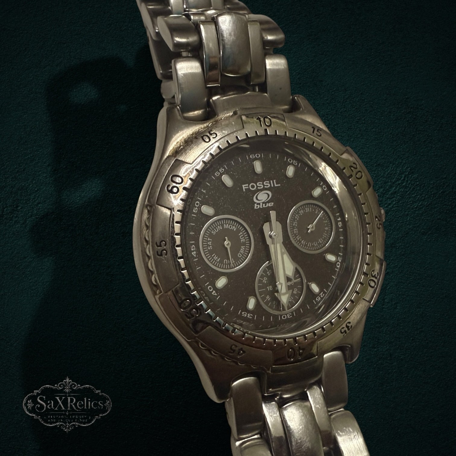 My Store FOSSIL Blue stainless steel chronograph wristwatch with a dark dial and metallic bracelet