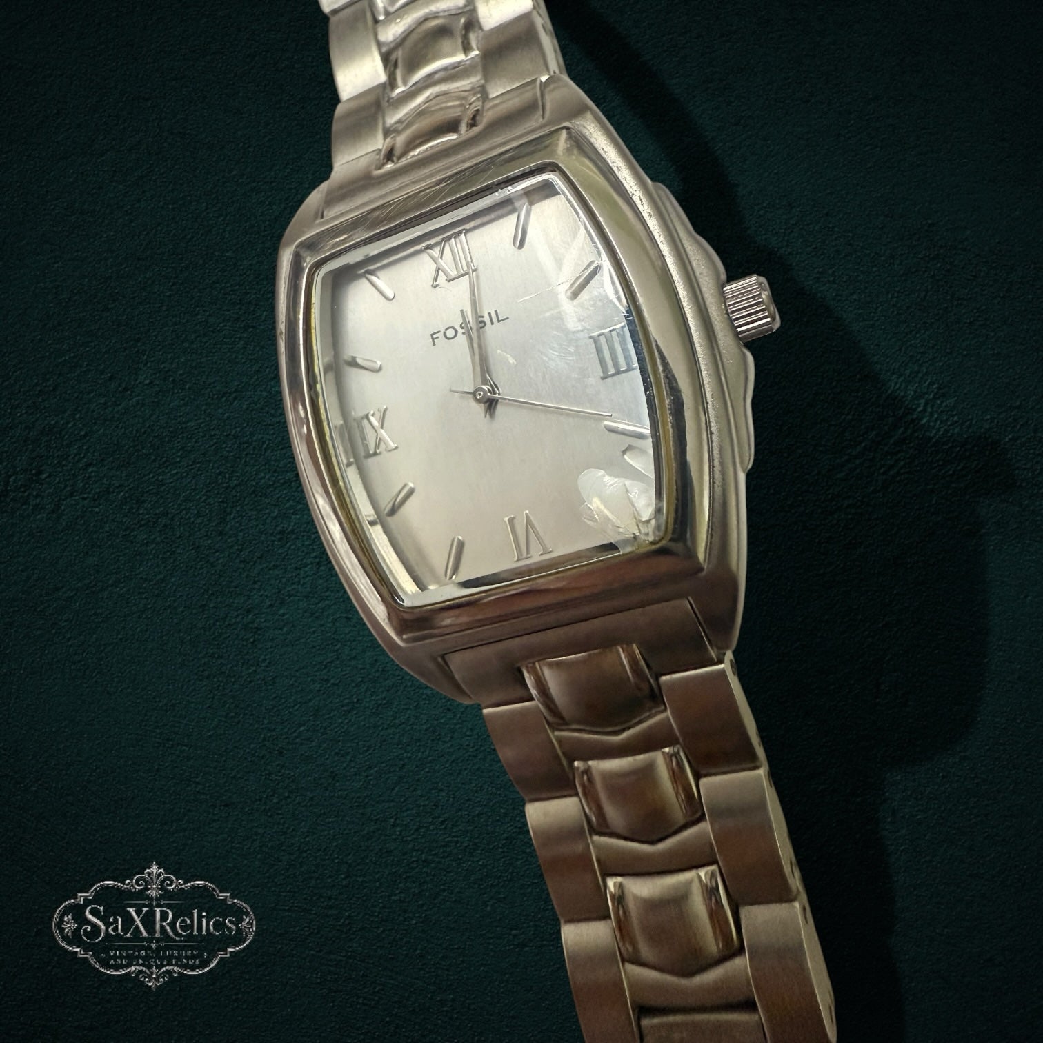 My Store Fossil silver-tone stainless steel tonneau-shaped wristwatch with Roman numeral indices and link bracelet.