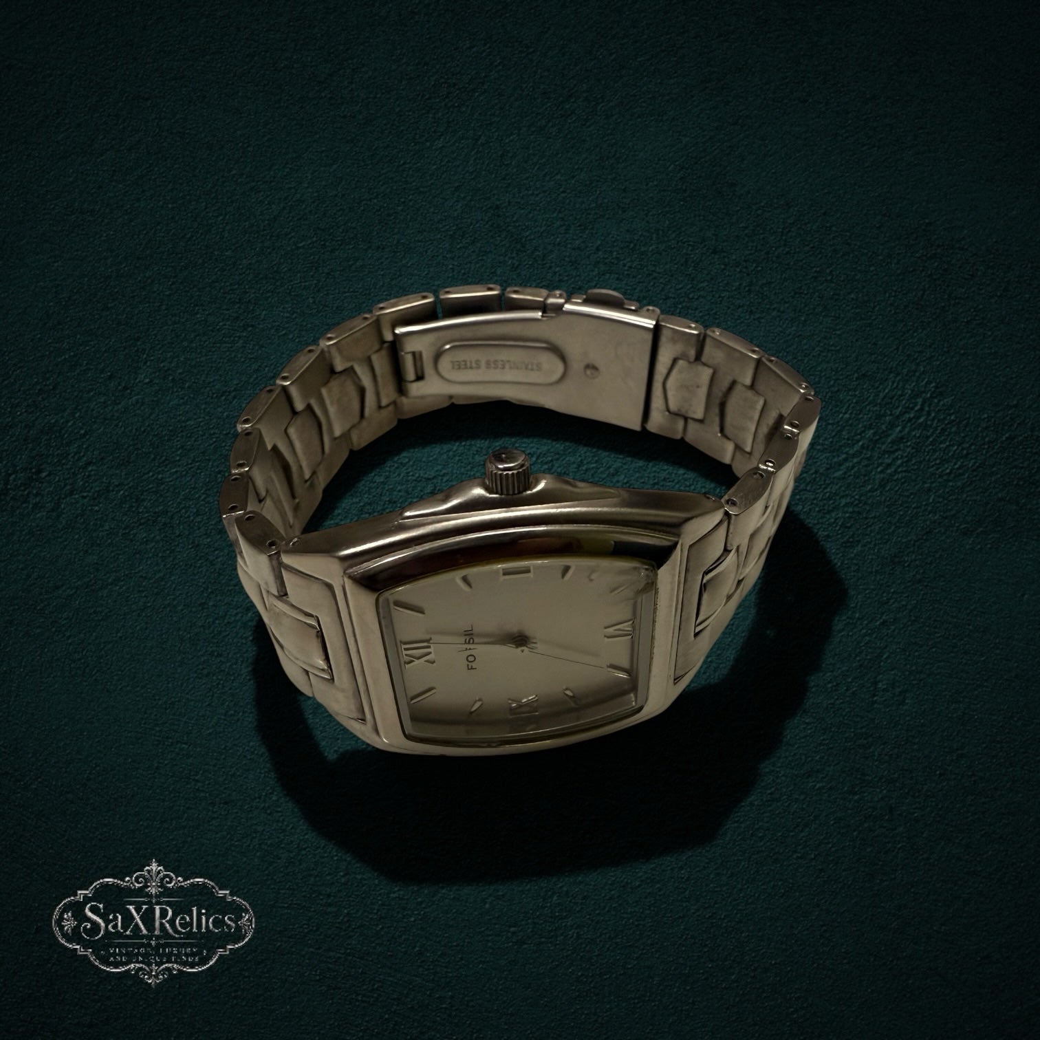My Store Fossil silver-tone stainless steel tonneau-shaped wristwatch with a link bracelet and Roman numeral dial.