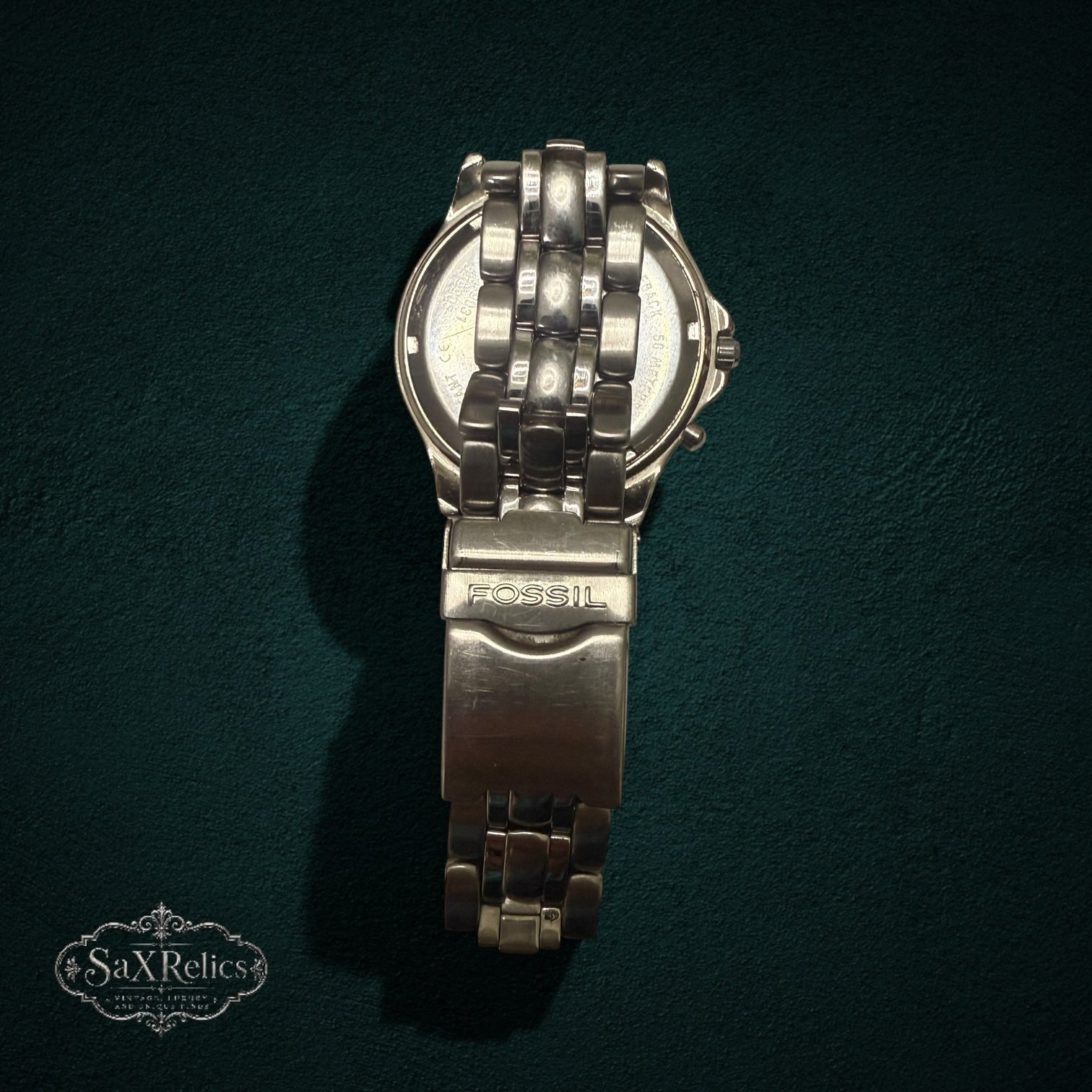 My Store FOSSIL Blue stainless steel chronograph watch showing the back of the case and metal bracelet link detail.