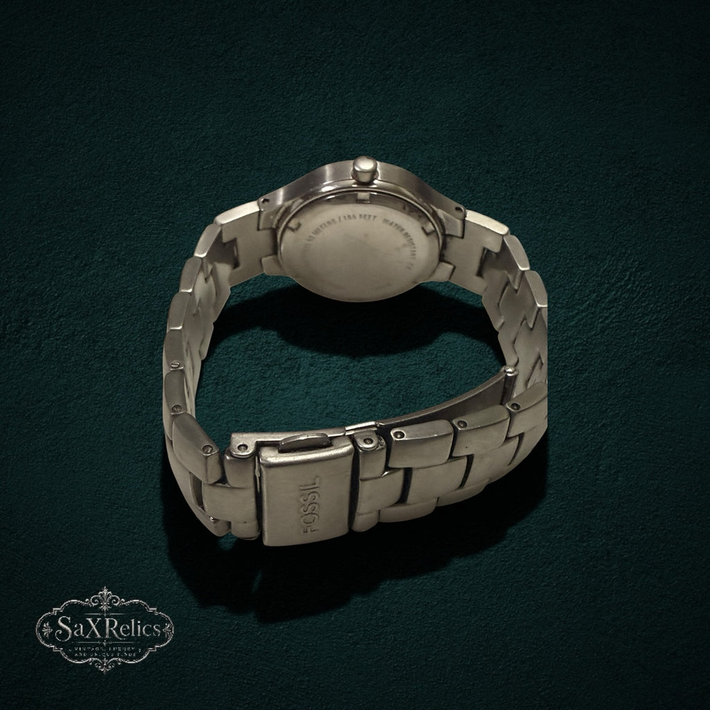 My Store Fossil stainless steel wristwatch showing the brushed metal link bracelet and secure clasp from the back