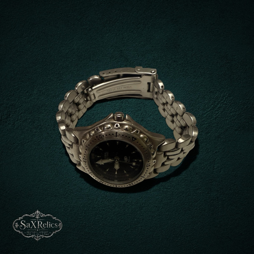 My Store Fossil stainless steel analog wristwatch with a black dial and textured bezel on a link bracelet