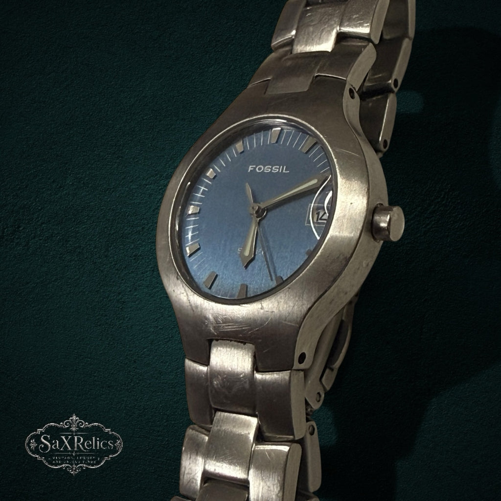 My Store Fossil stainless steel analog wristwatch with a blue sunray dial and brushed metal link bracelet.