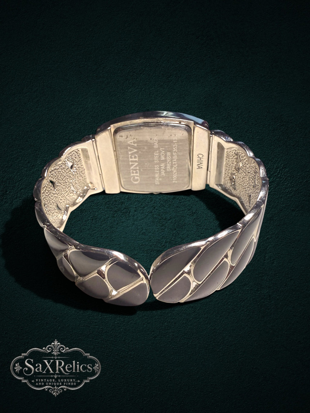 My Store Geneva quartz watch with a silver-tone sculptural cuff bracelet and stainless steel case back