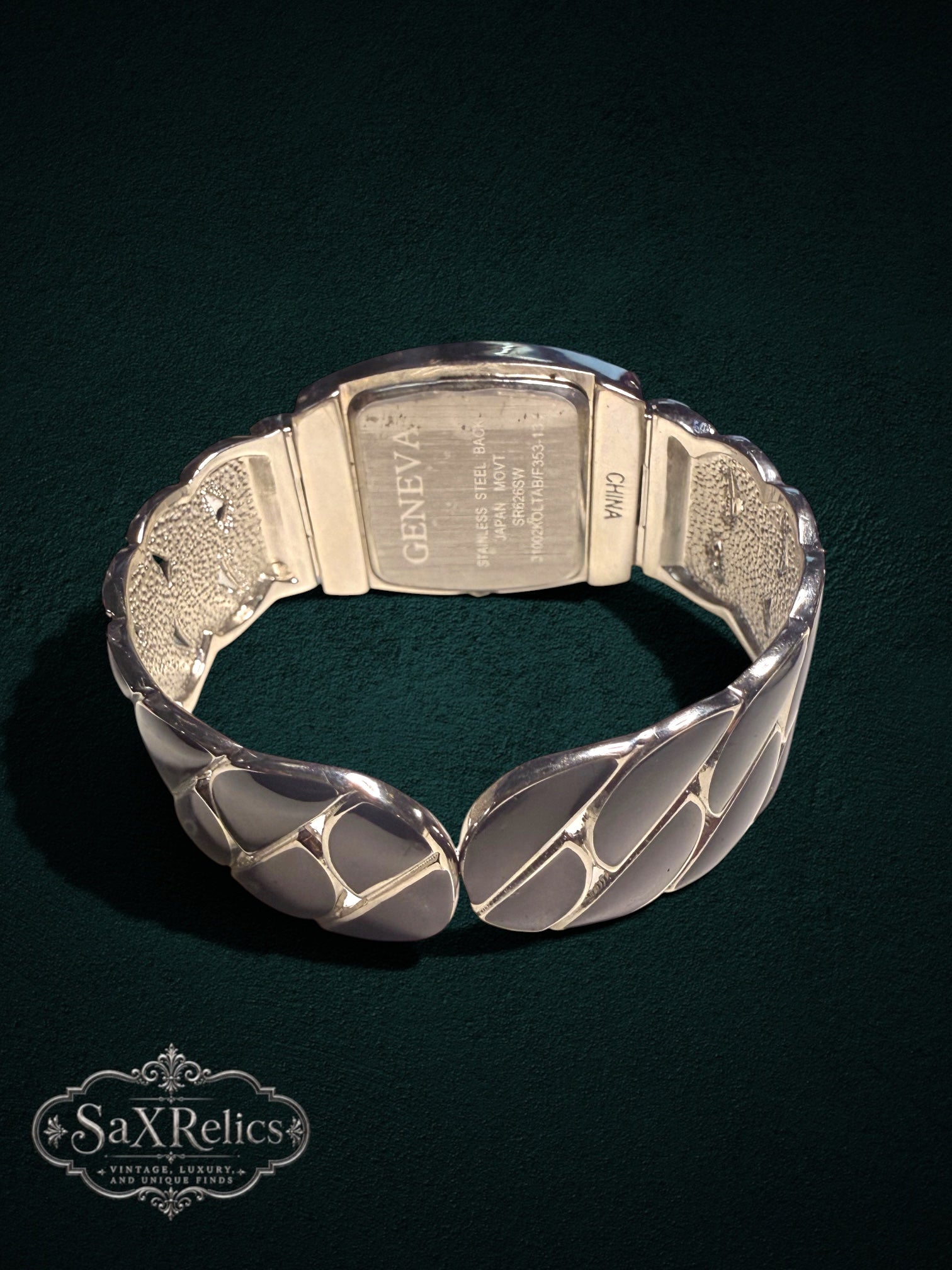 My Store Geneva quartz watch with a silver-tone sculptural cuff bracelet and stainless steel case back