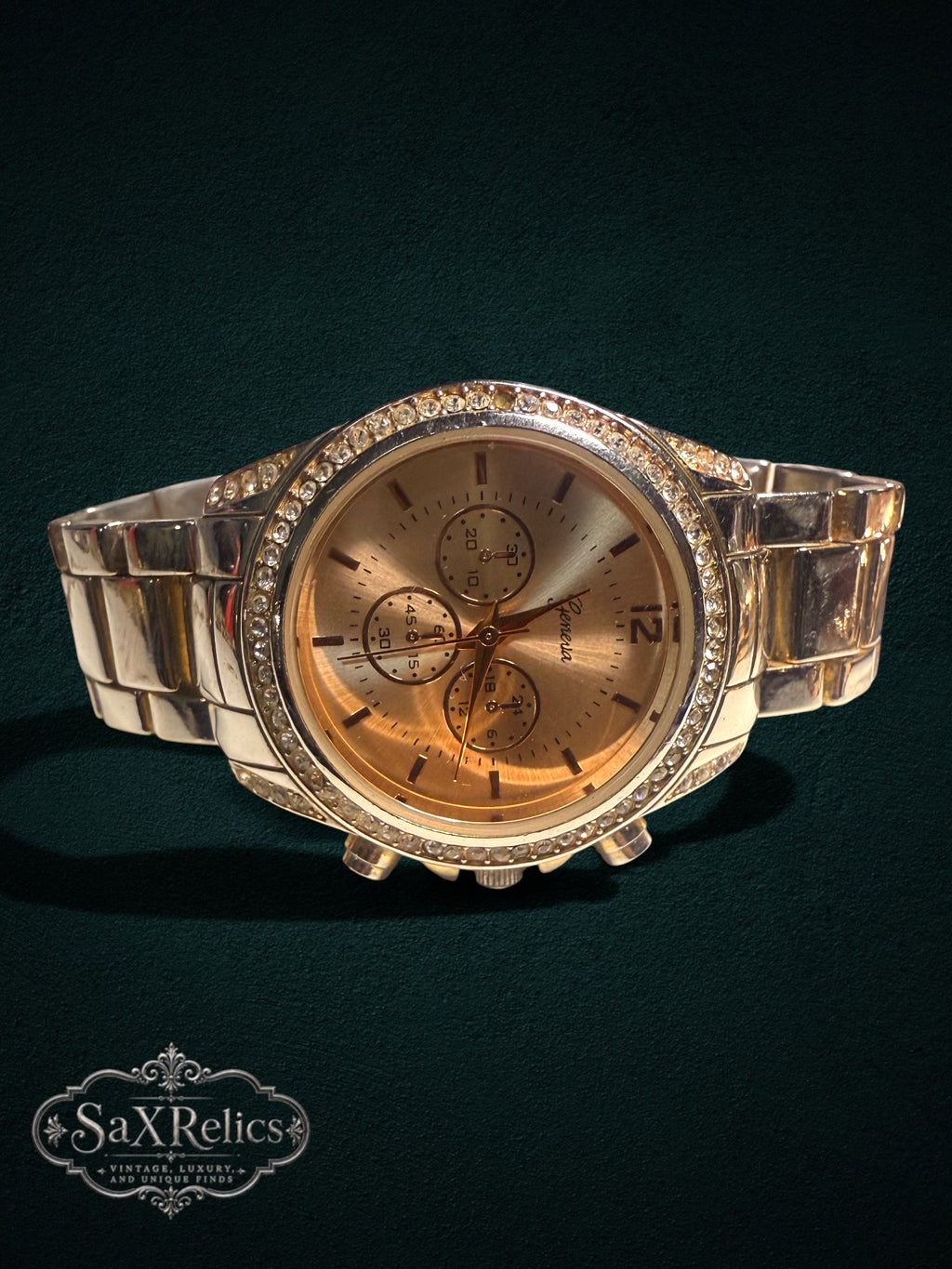 My Store Geneva gold-tone chronograph wristwatch with a crystal-encrusted bezel and polished metal link bracelet.