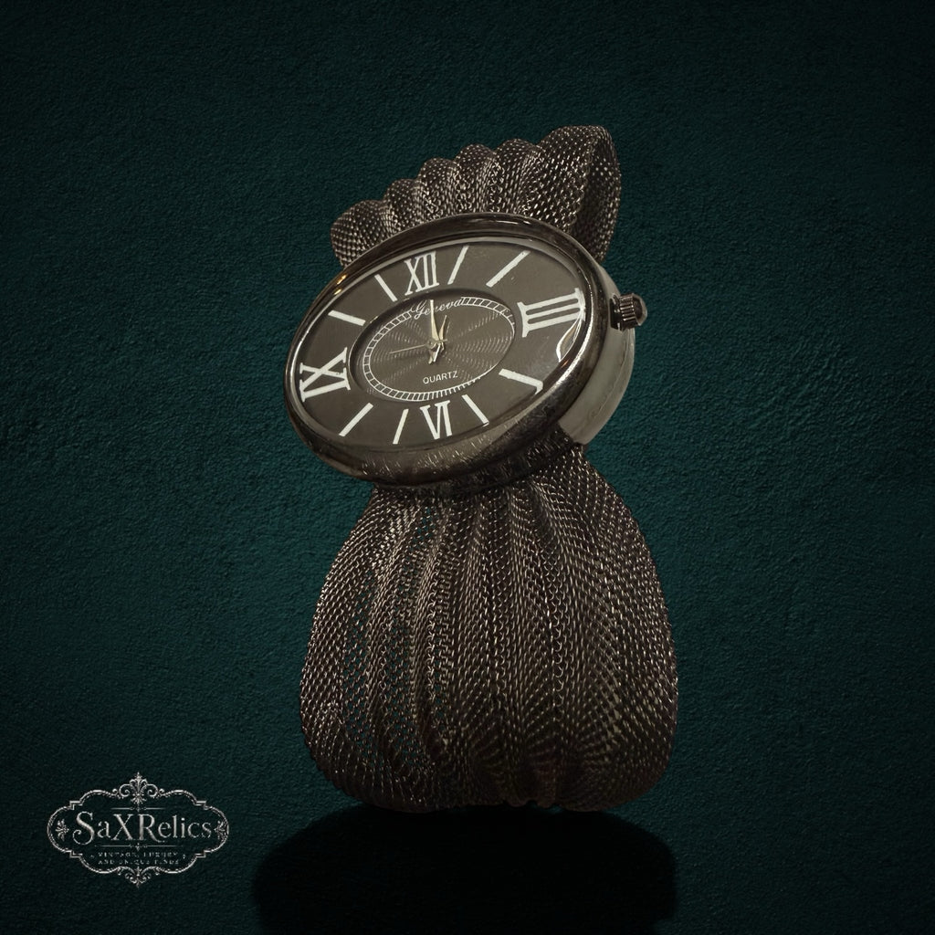 My Store Geneva vintage-inspired quartz wristwatch with a dark oval dial and a unique textured fan-like mesh band.