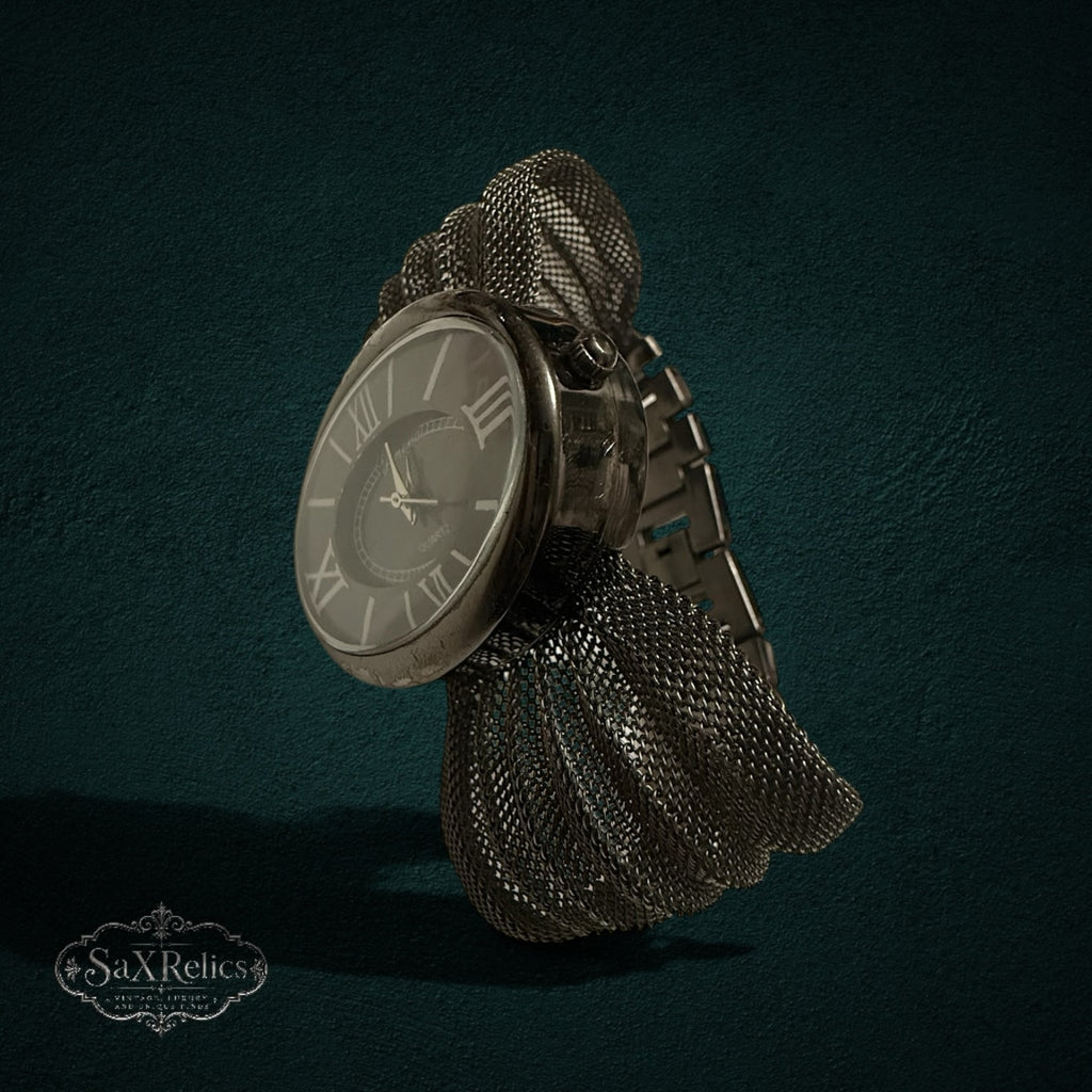 My Store Geneva vintage-inspired quartz wristwatch with an oval dial, Roman numerals, and textured metal mesh band.