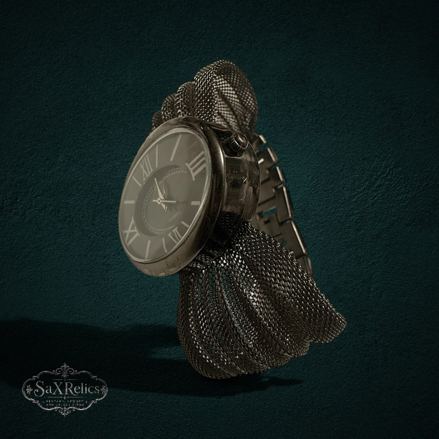 My Store Geneva vintage-inspired quartz wristwatch with an oval dial, Roman numerals, and textured metal mesh band.