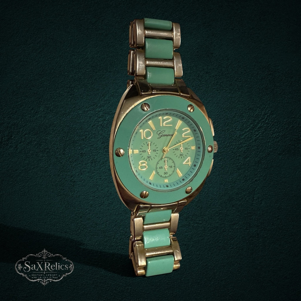 My Store Geneva analog wristwatch with a mint green bezel, gold-tone finish, and matching mint and gold link bracelet.