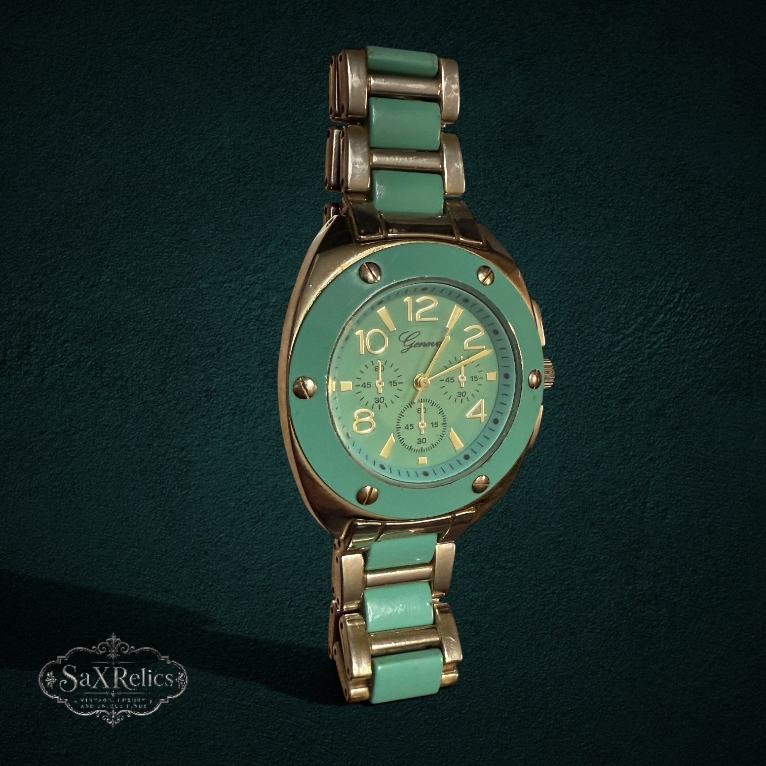 My Store Geneva analog wristwatch with a mint green bezel, gold-tone finish, and matching mint and gold link bracelet.