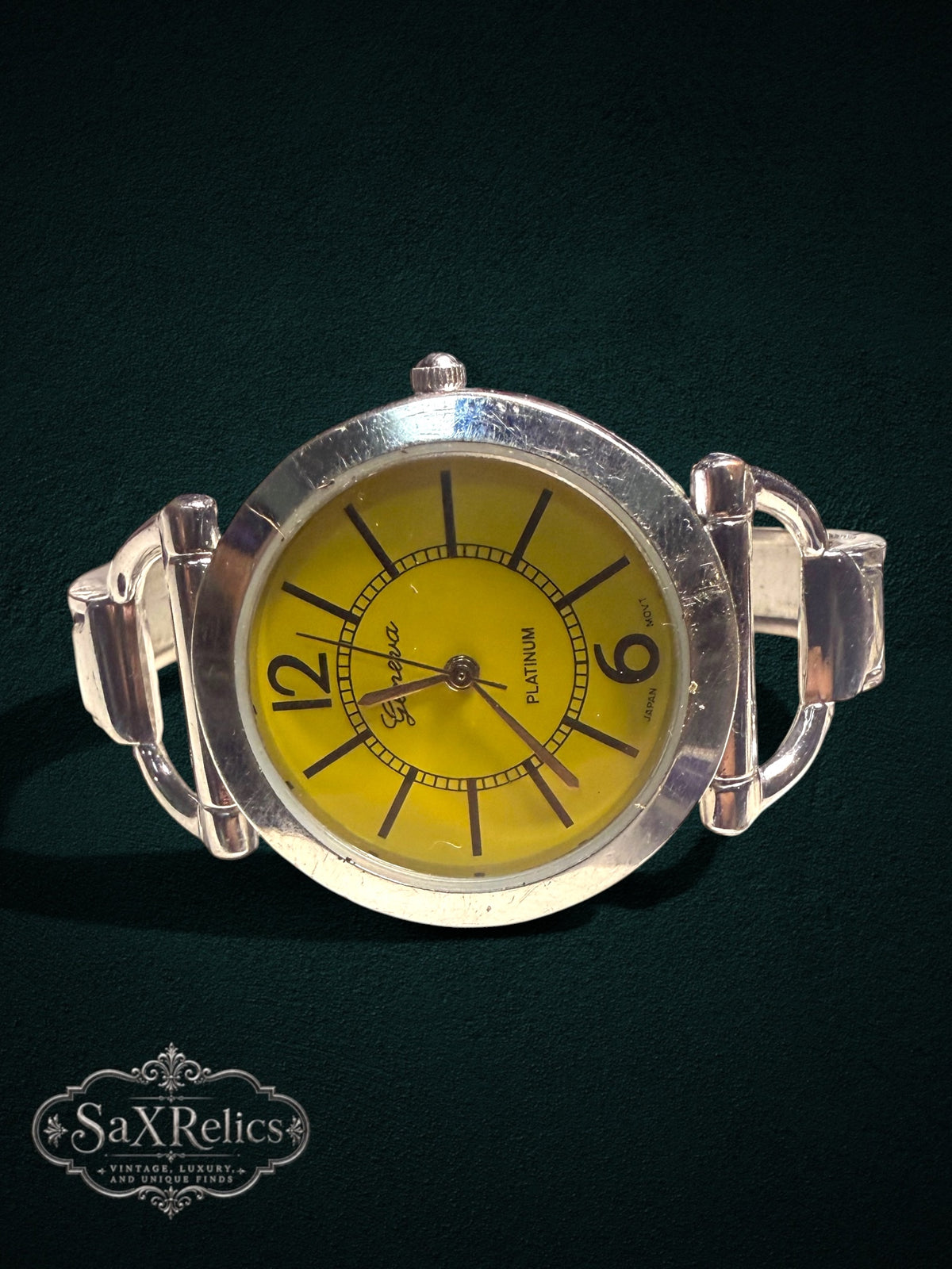 My Store Geneva Platinum bangle watch with a bright yellow dial and silver-tone polished bracelet