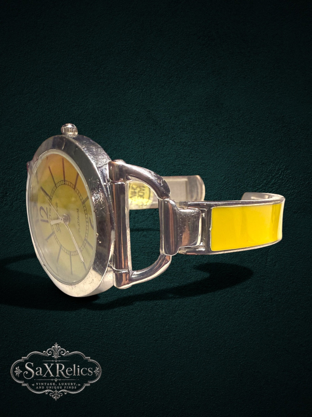 My Store Geneva Platinum analog bangle watch with a yellow dial and silver-tone enamel bracelet side view