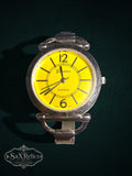 My Store Geneva Platinum analog wristwatch with a vibrant yellow dial and silver-tone bangle bracelet.